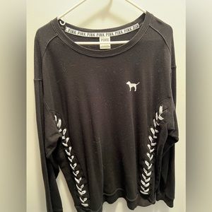 Black sweater with white lacing down the side. Size L